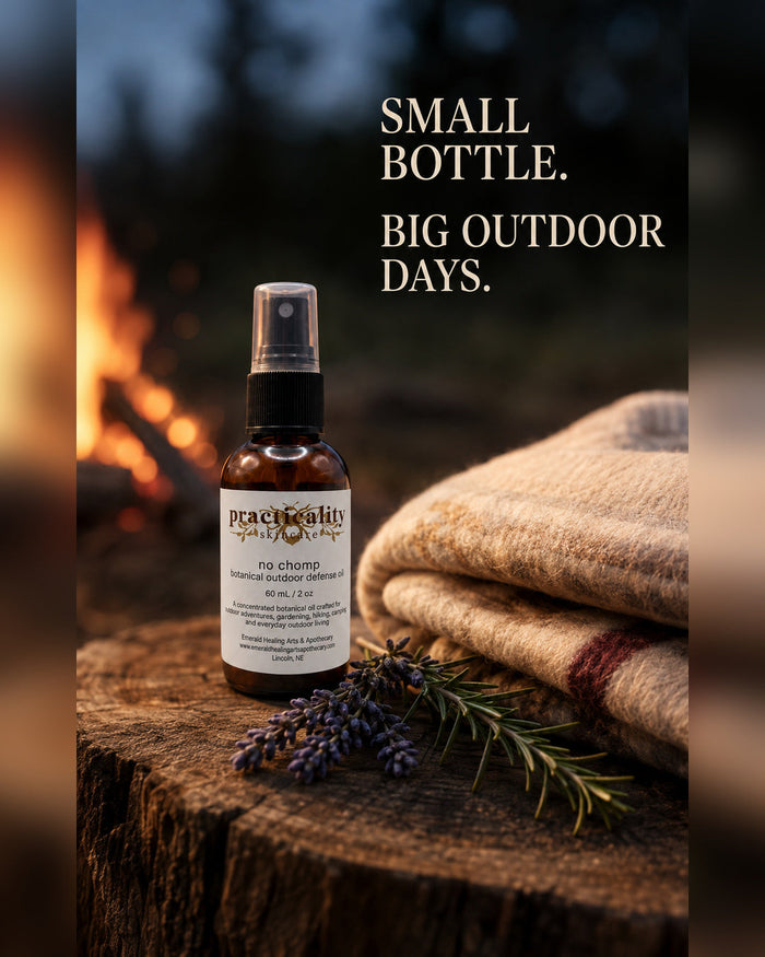 No Chomp botanical outdoor body oil beside a campfire and folded blanket
