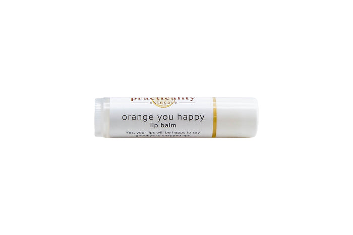 Practicality Orange You Happy Lip Balm tube on a clean white background